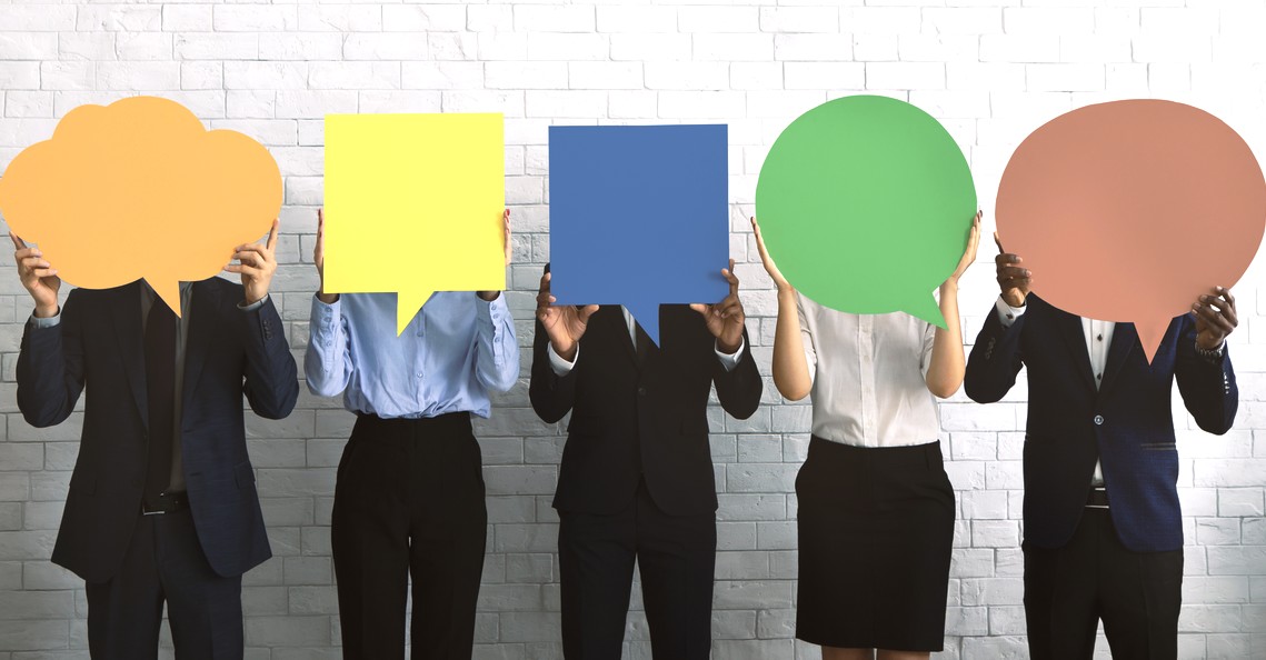 Group of corporate people hiding faces behind speech bubbles